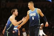 Luka Doncic (#77) and Kristaps Porzingis (#6) of the Dallas Mavericks.